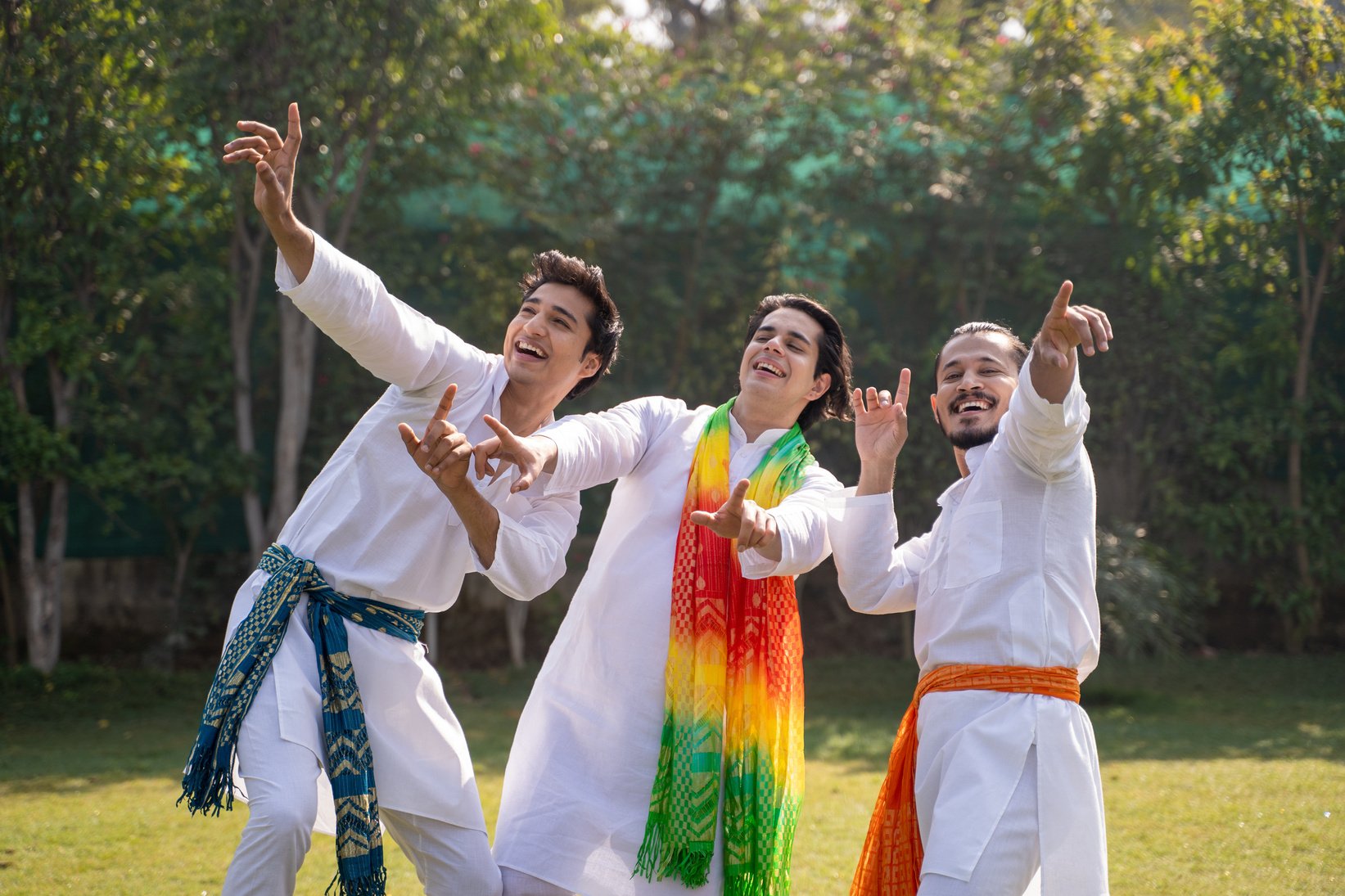 Indian men dancing at a Holi party